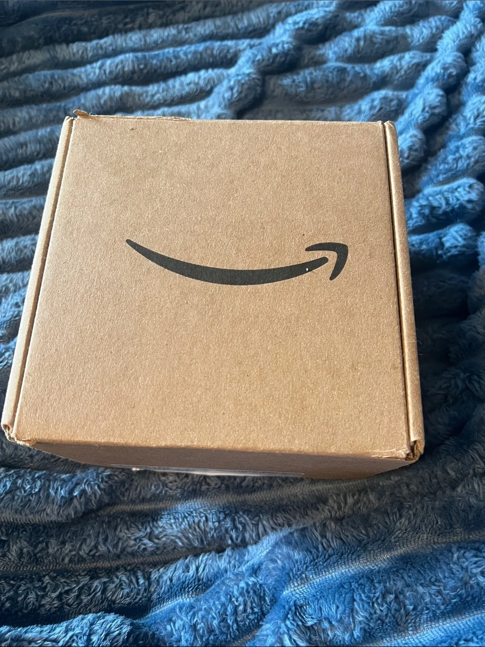 Amazon Alexa Black Bluetooth Speaker with White Charging Cable